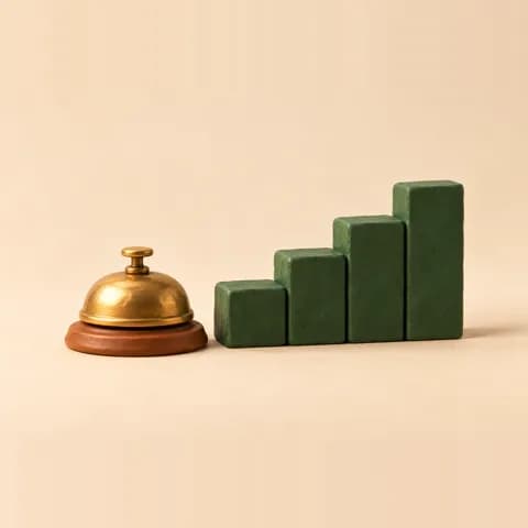 Clay desk bell beside a rising staircase of blocks.