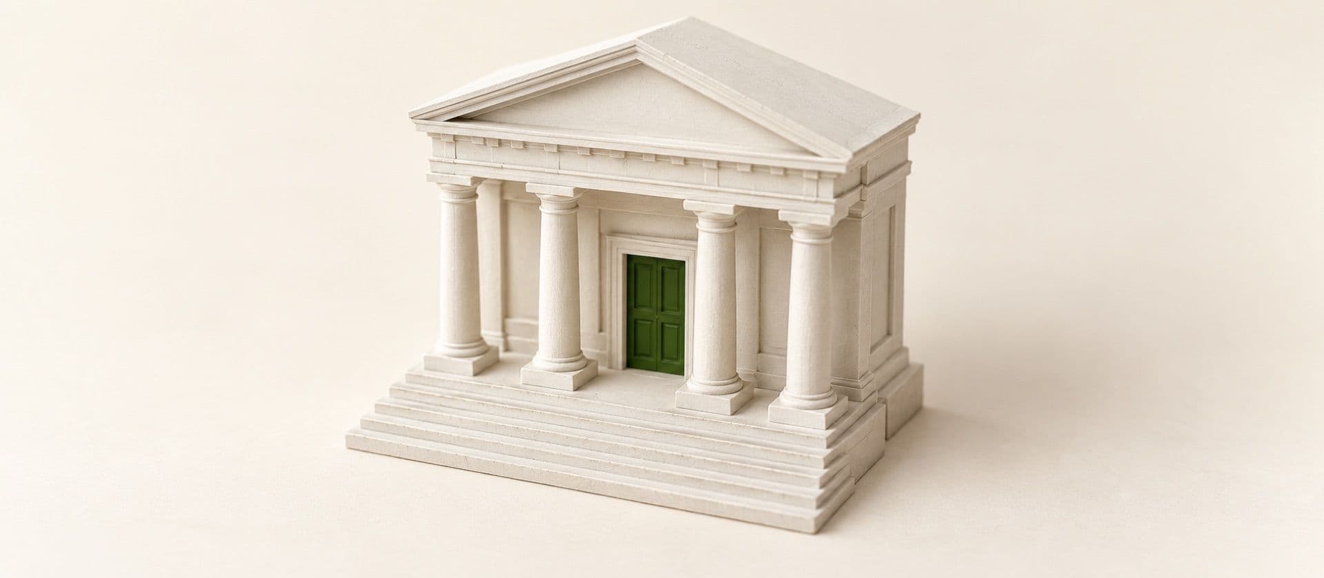A cream study model of a small classical bank front with four columns and steps, with the bank's door in green.