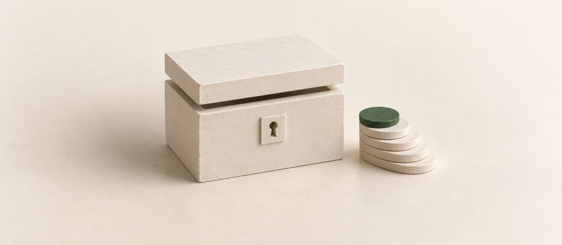 A cream study model of a small closed strongbox with its lid ajar, a short neat stack of six flat coins beside it stepping down in height like a staircase, with the top coin of the stack in green.